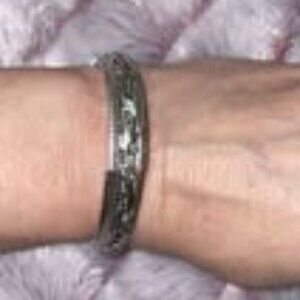 Silver tone clamper bracelet